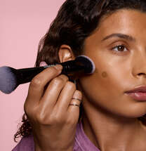 Model Applying Liquid Bronzer and Contour